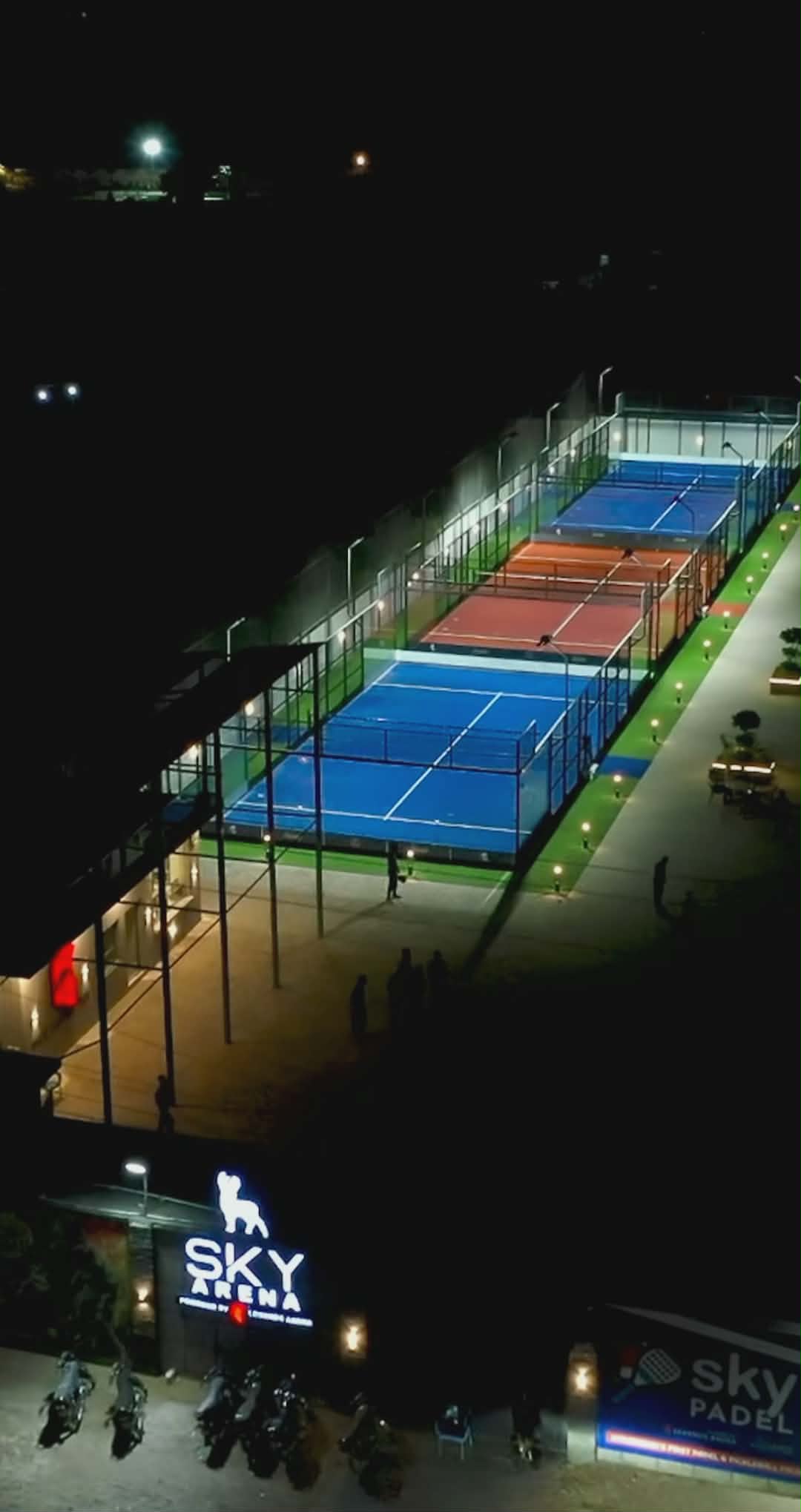 Sky Arena padel courts at night, aerial view